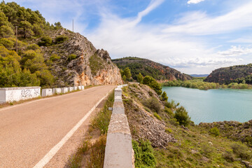 Beautiful road of Tranquera water reservoir in Nuévalos, Zaragoza, Aragón, Spain. Picture captured in a sunny summer day.