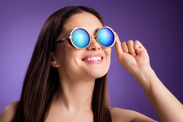 Photo of adorable funny mature woman naked shoulders smiling wear sunglass isolated violet color background