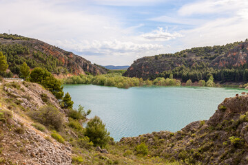 Naklejka na ściany i meble Tranquera reservoir situated in Nuévalos, Zaragoza, Aragón, Spain. Beautiful lake with mountains around it.