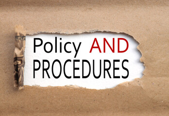 Policy & Procedure. text on torn cardboard. black letters on white paper