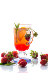 refreshing cool strawberry lemonade with lemon, ice and mint in a glass