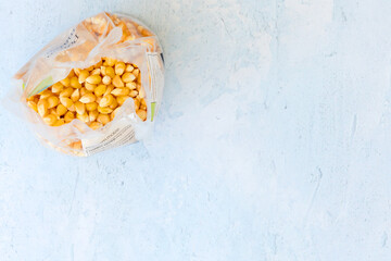 Popcorn kernals on blue background