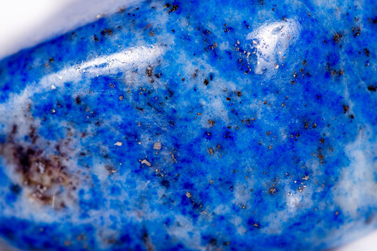 Macro mineral stone blue lapis lazuli (afghanistan) on white background