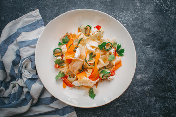 Vegetable salad with feta cheese, Restaurant white plate on a dark background