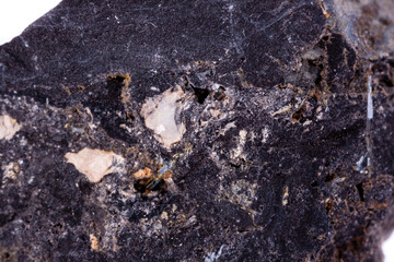 stone macro mineral ilmenite on a white background