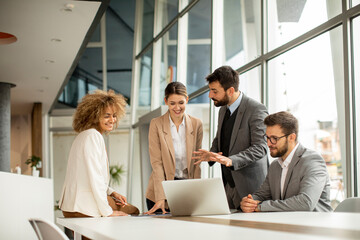 Multiethnic business people working together in the office - Powered by Adobe