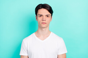 Photo portrait serious guy wearing white t-shirt isolated bright teal color background