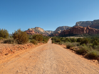 Dirt Road Leading to Rugged Red Rock Mountains in Central Arizona Wide