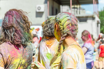 the pretty young woman in the color fest, colored face of the young woman, color festival in india