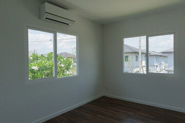 Fototapeta premium Empty room with glass window frame house interior with air conditioner on concrete wall