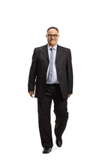 Full length portrait of a mature businessman smiling and walking towards camera