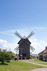Fototapeta na wymiar Large windmill against a bright blue sky