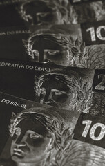Brazil money on dark background, concept of financial crisis and economic inflation.