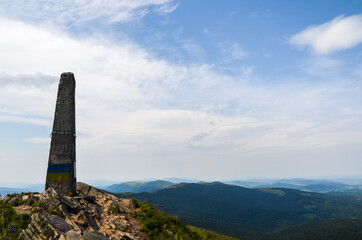 Rocky mountain peak of Pikuj against blue sky on summer day. Outdoor travel scene. East Beskidy, Carpathians Mountains, Ukraine