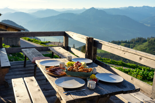 breakfast in a traditional hutte in tirol alms with fruits and wurst
