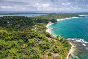 Fototapeta na wymiar Tropical Island Aerial View. Wild coastline lush exotic green jungle. Red Frog Beach in Bastimentos Island, Bocas del Toro, Central America, Panama.