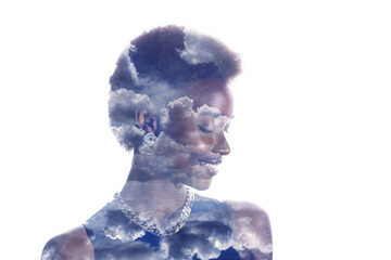 Multiple exposure image with clouds and sky inside positive smiling african american woman...