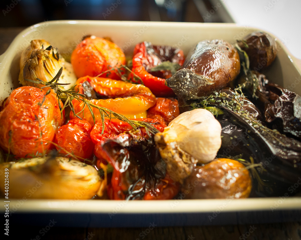 Wall mural chef preparing roasted veggies on the oven