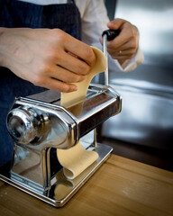 view of chef preparing fresh pasta