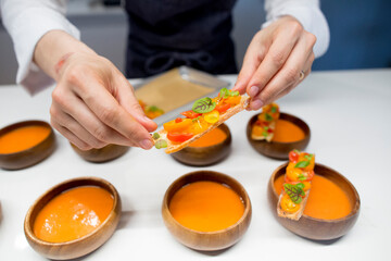 chef preparing gazpacho and healthy appetizers