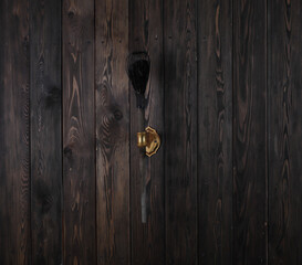 extinguished torch,torch on a wooden wall