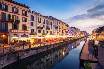 Naviglio Grande canal at the evening.when the lights of the city and the bars come on and the nightlife of Milan begins, Milan, Italy. - obrazy, fototapety, plakaty