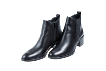 Pair of ladies black leather trendy boots, on white background