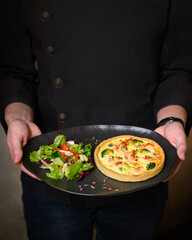 chef preparing pizza