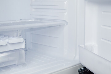 The freezer in the refrigerator is very clean. side view 