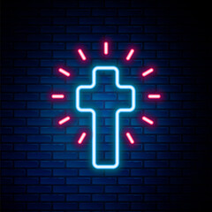 Glowing neon line Christian cross icon isolated on brick wall background. Church cross. Colorful outline concept. Vector