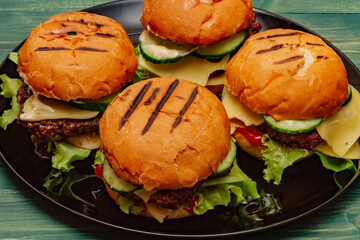 home made burgers on wooden background. cheeseburger, burger, hamburger, beef