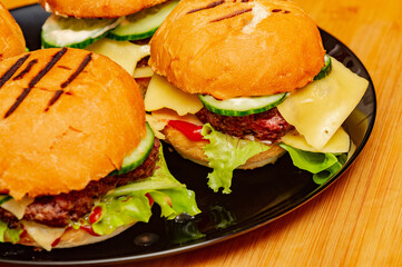home made burgers on wooden background. cheeseburger, burger, hamburger, beef