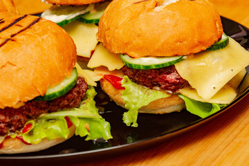 home made burgers on wooden background. cheeseburger, burger, hamburger, beef