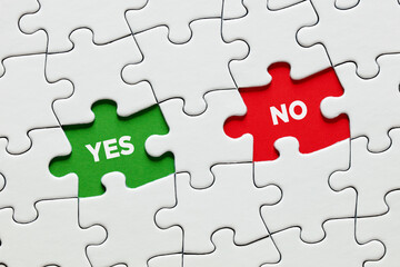 Missing puzzle pieces with the words yes versus no. Positive or negative answer or voting yes or no