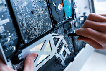 Technology repair of pc electronic equipment. Computer service. Technician engineer man do maintenance of hardware.