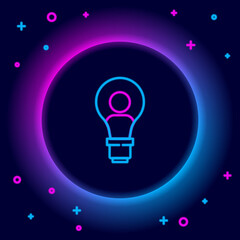 Glowing neon line Human head with lamp bulb icon isolated on black background. Colorful outline concept. Vector