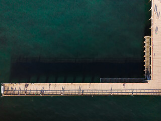 Aerial view pedestrians walking on Palanga pier bridge - famous landmark in summer. Lithuania...