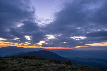 Beautiful colorful panorama of the sunset in the Carpathian mountains