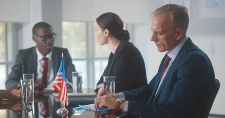 Group of business people brainstorming together in meeting room - Powered by Adobe