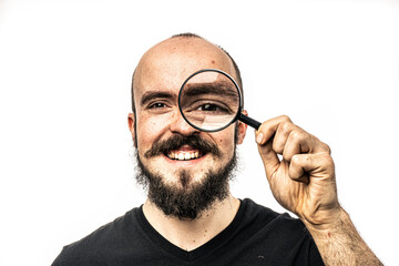 The man poses in a photo studio.
