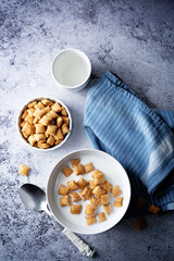 Fresh breakfast with wheat pads with milk in a bowl