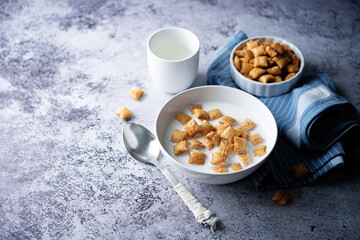 Fresh breakfast with wheat pads with milk in a bowl