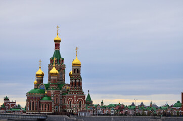Fototapeta na wymiar View of the Cathedral of The Epiphany in cloudy weather in the evening with a copy space. Russia Yoshkar-Ola 01.05.2021. High quality photo