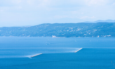 The breakwater in front of the port of Trieste, Italy