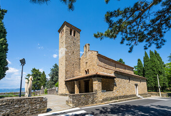 Fototapeta na wymiar Muggia, Italy. June 13, 2021 view of the church of St. Mary Assunta in the old Muggia archaeological park