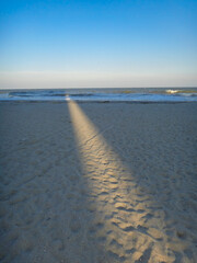 Natural spotlight on the beach by the ocean
