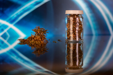 bottle of medical cannabis. alternative medicine. medical marijuana in glass jar
