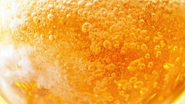 Super Slow Motion Detail Shot of Pouring Beer into Glass at 1000fps.