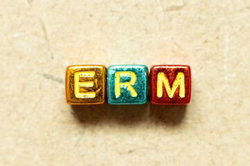 Metallic color alphabet letter block in word ERM (Abbreviation of Enterprise risk management) on...