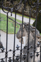 unicorn statue in Mirabell garden, Salzburg. focus on unicorns and blur fences.